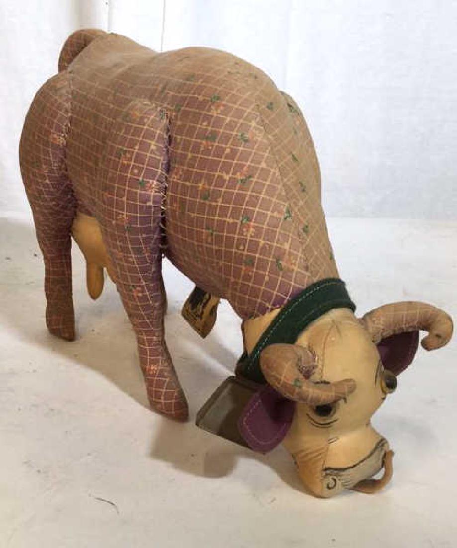Vintage Folk Art hand Sewn Cow: Soft sculpture cow with ringing bell , collectible toy, label affixed to underside reads cartoons in Cloth, Measures app ht 9 inches length app 16 inches folk art, stuffed animal, decor piece