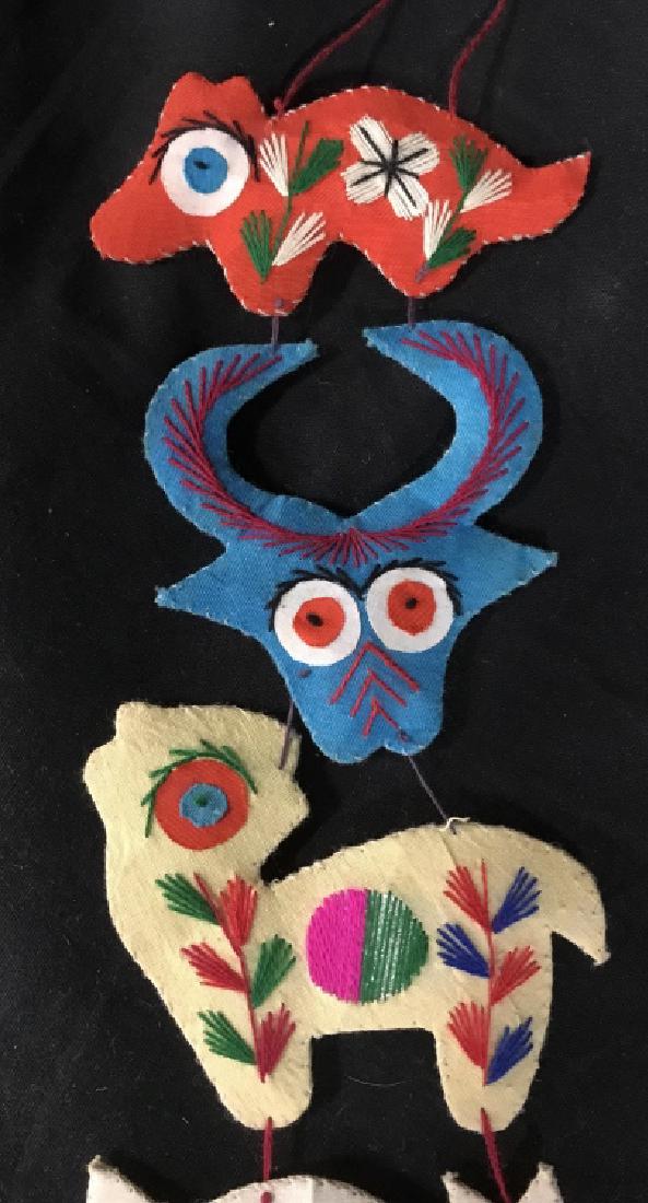 Hand Stitched Folk Art Animal Chain Wall Hanging: Hand Stitched Folk Art Animal Chain Wall Hanging In vibrant Multicolored fabric and stitching, measures approximately 33 inches long x 5 inches wide. wall decor, wall hanging, home accent