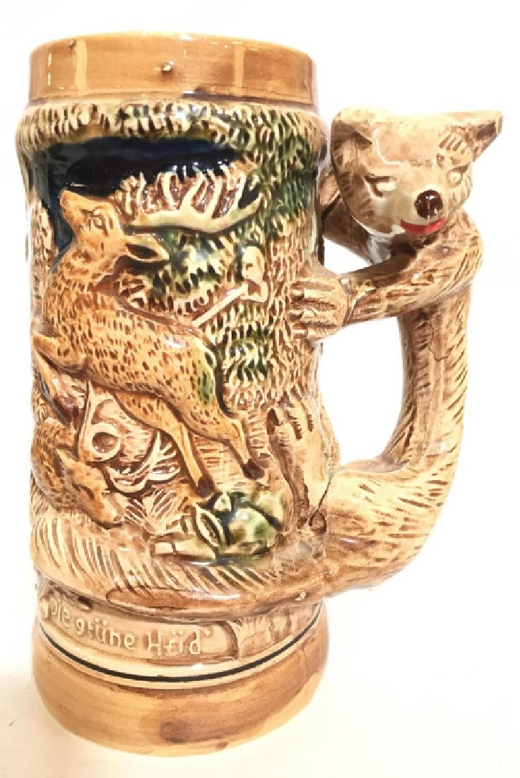 Lot 3 Ceramic Beer Steins: Lot includes 3 unique ceramic beer steins. One has German characters, one reads mustache stein, the third reads LAS VEGAS. Largest stein measures approx 7 inches tall 5 inches wide. collectible, barwa