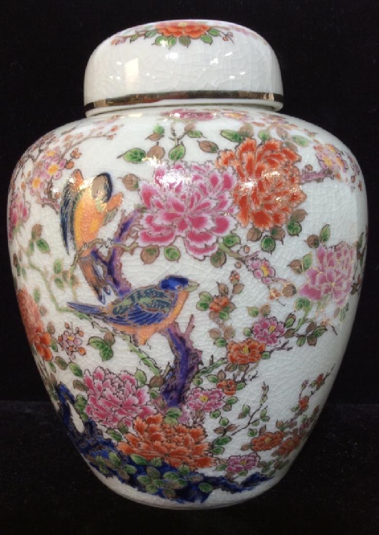 Japanese Porcelain Ginger Jar: Painted / Enamel bird on flowers branch design, with gold toned accents, marked with asian characters on underside, measures app 6 1/2 in by 5 in in diameter. evident crazing, asian arts and crafts, d
