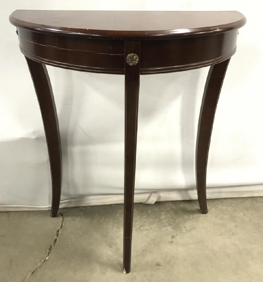 Vintage Demilune Console Table: Vintage Demilune Console Table In dark toned wooden finish on three splayed legged base, crack to wooden skirt panel, chip to leg and surface scratches throughout, measures approximately 24 inches wid
