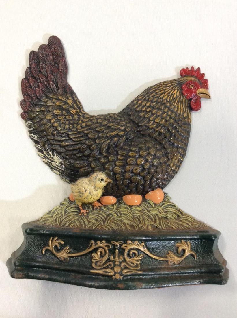 Vintage Cast Iron Hen and Chicks Door stop: Vintage Cast Iron Hen and Chicks Door stop Painted cast iron Doorstop hen on nest with eggs and chick, with additional filigree motif. Measures approx 11 in by 11in. Vintage collectible, farmhouse dec