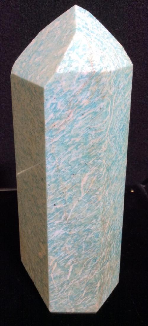 Amazonite crystal Tower Obelisk, Madagascar: Pale blue and white toned Amazonite crystal from Madagascar, shaped as an obelisk. Measures approx 7 1/2 in by 3 1/2 in by 2 in. Some surface wear. Desk / office accessory, home accent / decor. Natura