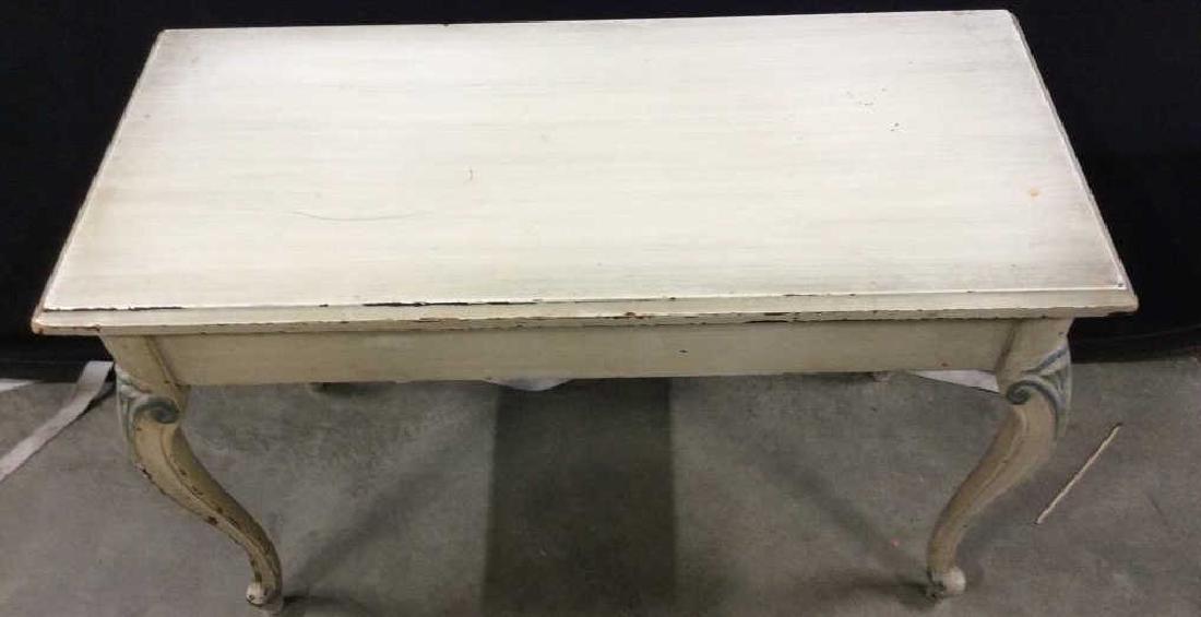 Painted wooden Piano Bench: Painted piano bench with interior storage, off white painted wood with blue toned accents, cabriole legs. Measures approx 19 in by 30 in by 14 in. Wear To paint. Bench, seating, creative storage, Sofa
