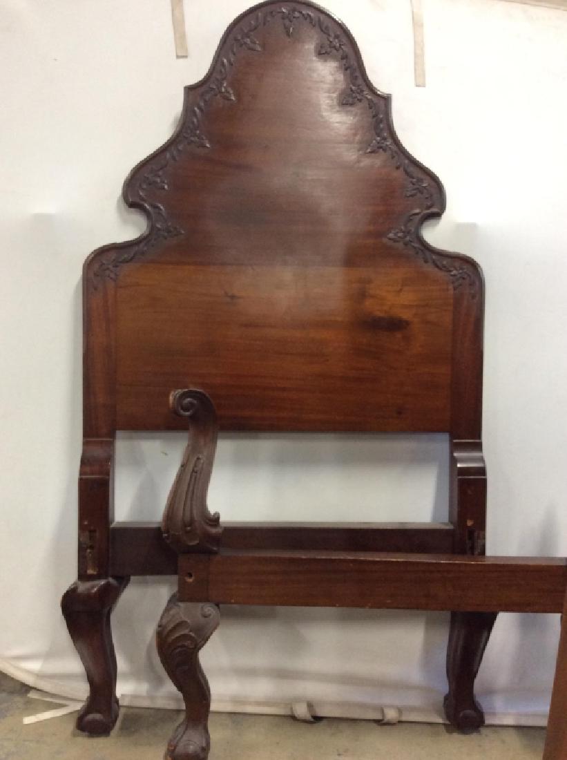 Antique Claw Foot Bed: Twin bed, dark toned wood, carved claw and ball feet, some surface wear and chips to wood, appropriate to age. Head board footboard and wood rails. 4 head board measures approx 65 in tall by 36 in, ho