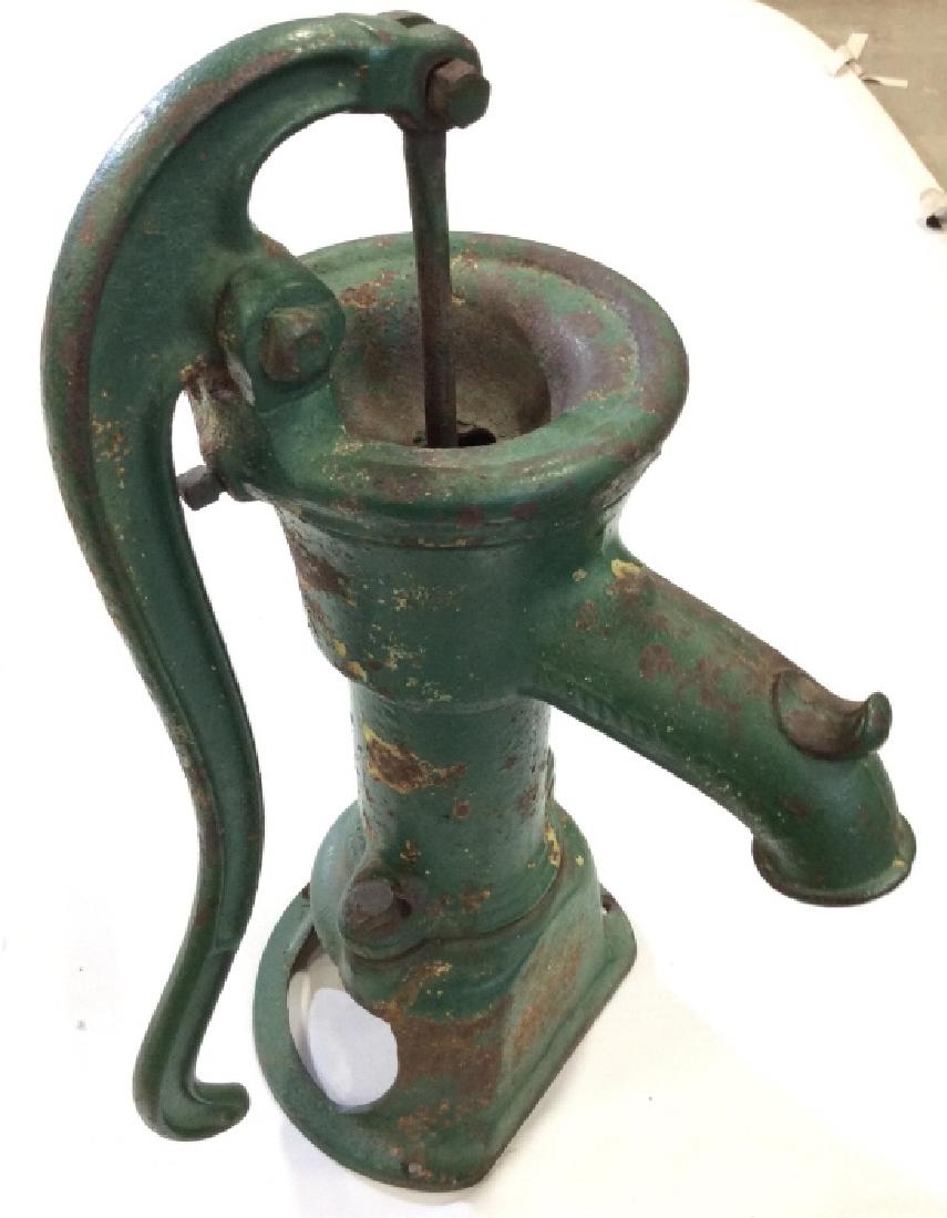 Antique Indoor Water Pump: Green toned painted metal, possibly cast iron. Water pump. Some extensive wear to finish appropriate to age. Measures approx 22in by 12 in by 7 in. Farmhouse collectible, vintage kitchen accessory, ru