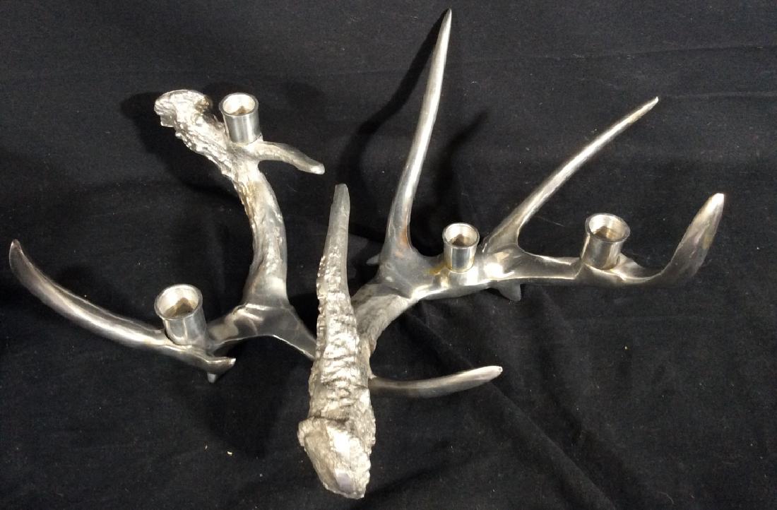 Silver Toned Metal Antler Candelabra: Silver toned metal, in form of stacked deer antlers, measures approx 6 in tall by 17 in by 16 in. Centerpiece, tableware, tabletop decor, home accent, rustic accent piece. 4
