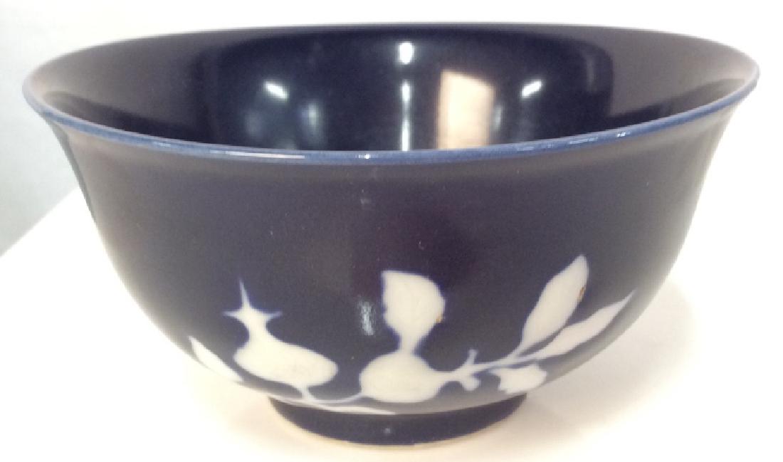Vintage Asian Blue Glazed Dish: Dark blue toned glaze with white toned floral branch design, measures app 2 1/2 in by 4 1/2 in. Trinket dish, finger dish, tableware, tabletop accessory. Asian arts and craftsman, decorative arts and 