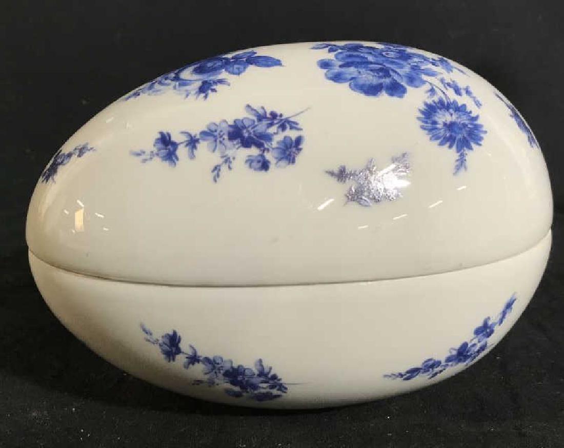French Limoges Porcelain Egg Box: Marked u deride for Limoges, porcelain tableware, keepsake Box, decorative accessory, Lidded box in shape of egg, white with blue floral pattern, measures ht app 5.5 inches length app 7 inches width 6