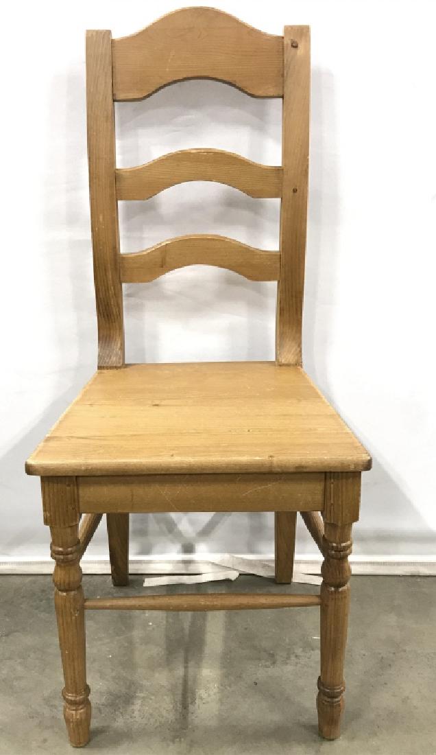 Carved Wooden Side Chair: Side chair is wooden. Contains carved wooden detail. Chair is tan toned. Side chair, dining chair, wooden chair. Measures approx 40 inches tall 17 inches wide, 28 inches deep. 6