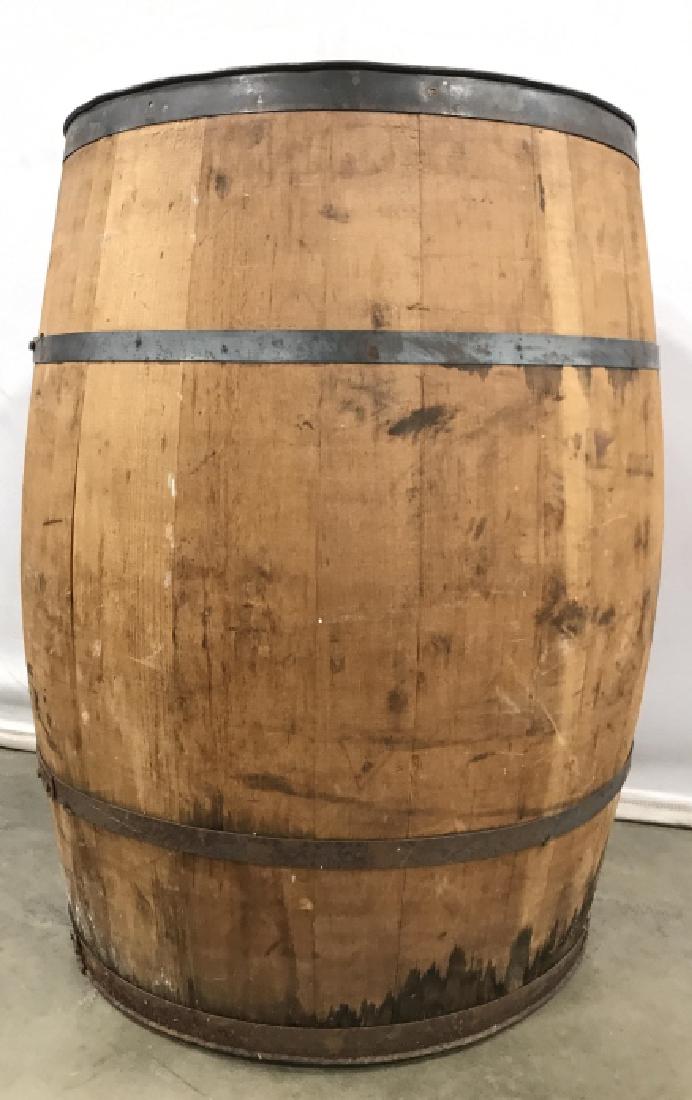 Vintage Oak Toned Wooden Wine Barrel Vintage Oak Toned: Vintage Oak Toned Wooden Wine Barrel With metal exterior support rings, measures approximately 30 inches tall x 21 inches in diameter, water marks to lower portion of barrel, surface wear and marks du