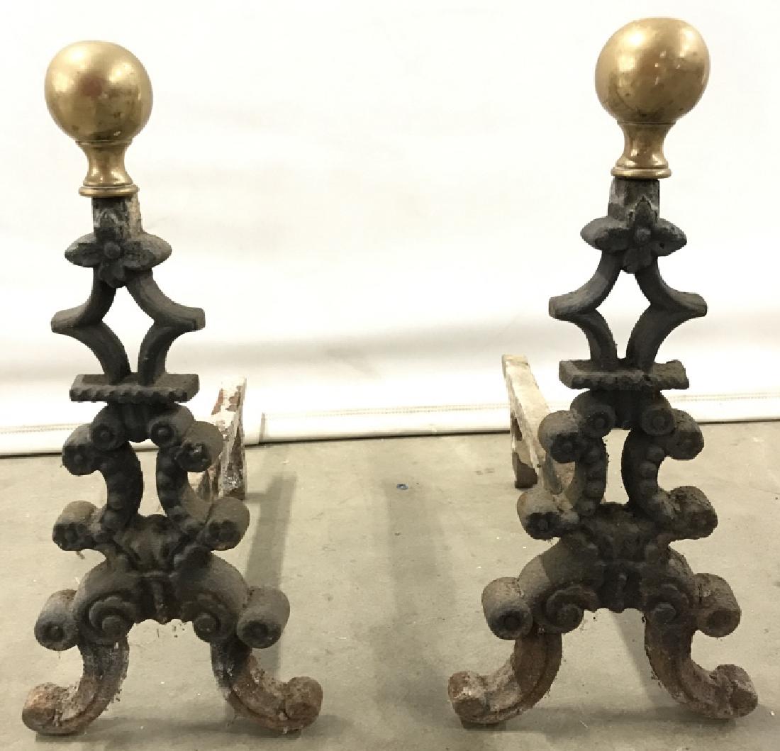 Pair Brass & Rod Iron Andirons Tops of Andirons have: Tops of Andirons have spherical shaped structure. Each measures approx 13 inches tall and long 6 inches wide. Each have evident wear. Home accent, andirons, firplace accessories, fire pit accessories.