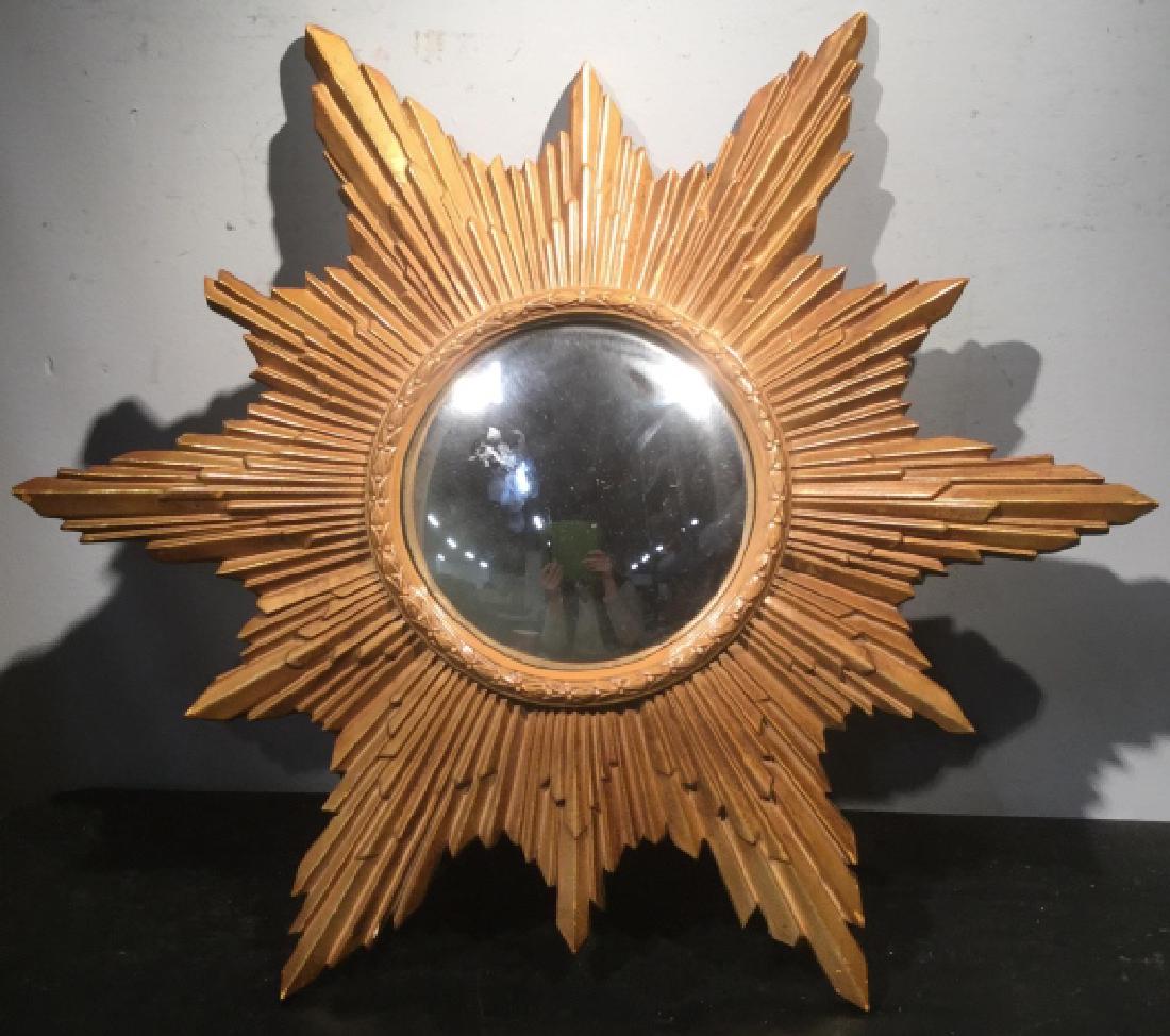 Convex Mirror in Gilt Sunburst Frame Frame is painted: Frame is painted material composite. Measures approx 23 inches in diameter. Decorative wall hanging, interior home decor, unique sunburst mirror. 7