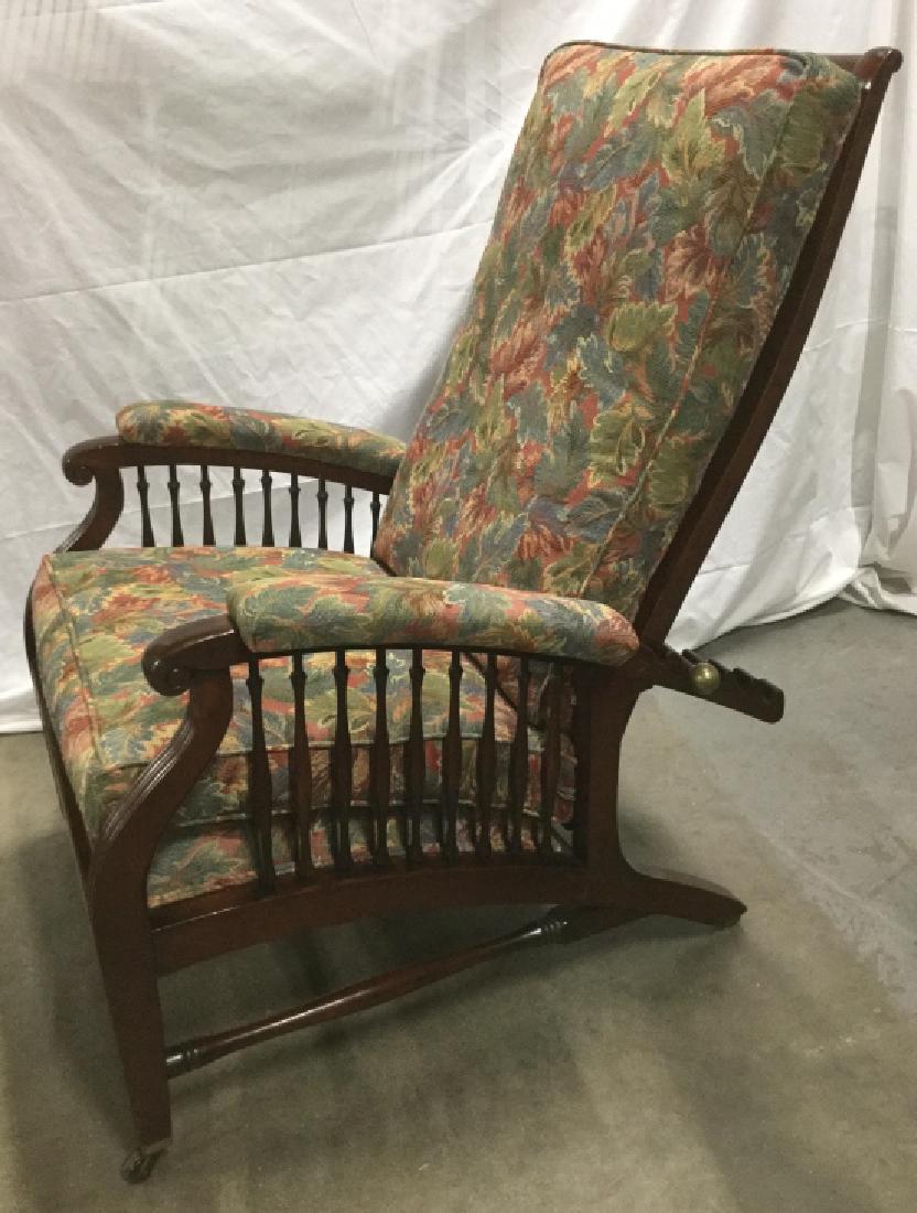 Antique Arts & Crafts Style Morris Chair: Antique arts & Crafts Style Morris Chair, adjustable recliner. Chair has wood frame with floral fabric Upholstered Cushions, including on arms. Chair sits on casters. Some Some light scratches on wood