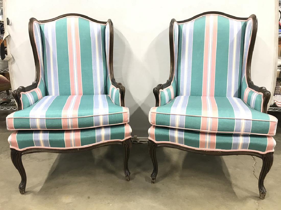 Lot 2 Vintage Wingback Chairs: Lot include 2 Upholstered wingback chairs. Each has pink, teal, light blue, & white toned upholstery Chairs measure approx 43 inches tall 27 inches wide 31 inches deep. Home furnishings, home accessor