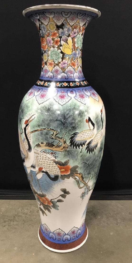 Chinese Hand Painted Floor Urn W Crane Motif: Chinese Hand Painted Porcelain Ceramic Floor Urn, multicolored floral leaf and crane motif with gold toned painted highlights, measures approximately 38 inches tall x 13 inches in diameter, some areas