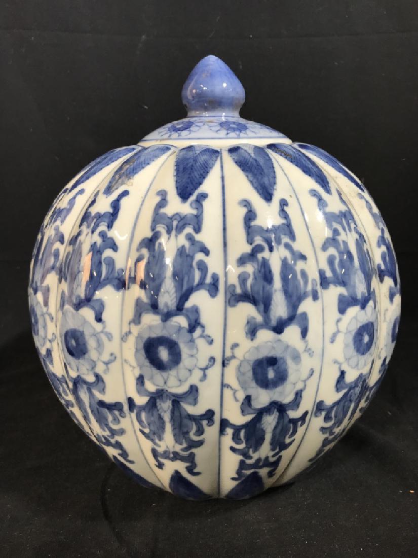 Chinese Blue & White Porcelain Lidded Jar: Jar has ribbed pumpkin texture and floral motif. Measures approx 10.5 inches in height with lid, 8 inches in diameter at widest point. Some minor surface wear, might need cleaning. Asian ceramics, pot