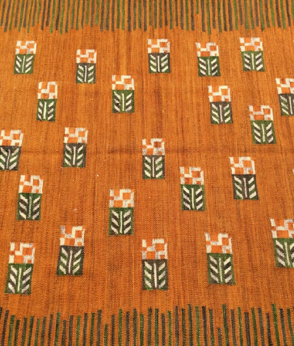 Handmade Multi Toned Wool Rug: Rug is wool and handmade. Contains geometric detail with tones of green, orange, and cream. Rug has fringes. Measures approx 89 inches long 62 inches wide. home accessories, home decor, home accent br