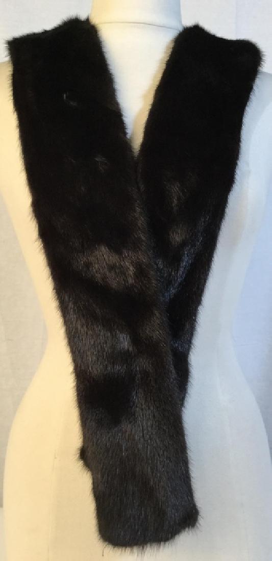 Luxury Ladies’ Mink Fur Scarf: Luxury ladies’ Mink fur scarf. Scarf measures approx 66 inches in length, 3.5 inches in width. Mink fur is deep brown/black in tone. Ladies’ women’s fashion accessory, luxury fashion accessory, 