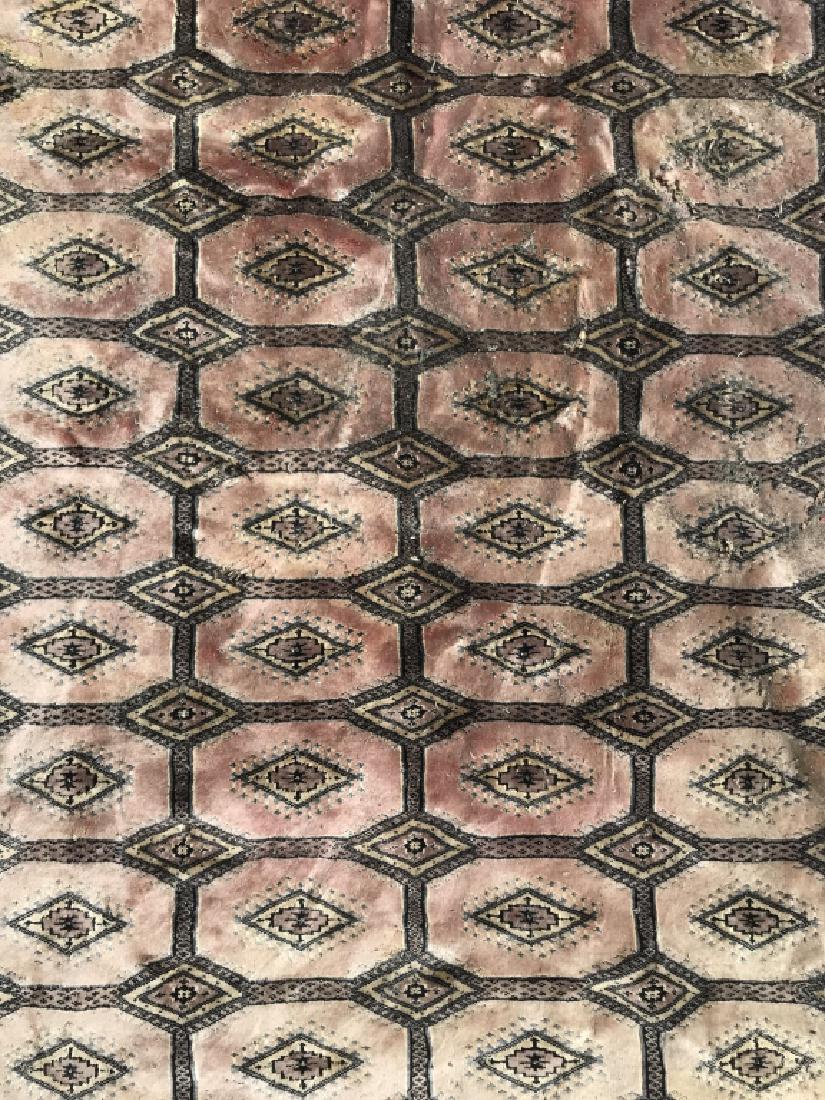Handmade Multi Toned Wool Rug: Rug is handmade and wool. Contains tones of black, pink, & slate. Contains fringes. Measures approx 104 inches long 72 inches wide. Contains evident wear & fading. Needs cleaning. Home decor, home acc