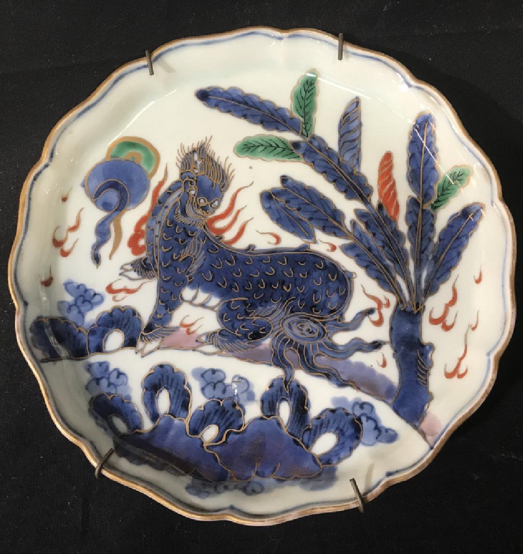 Antique Japanese Imari Plate W Chimera Motif: Antique Japanese Imari Somenishiki porcelain plate with chimera, giraffe, foo dog, animal motif. Plate has certificate of date, issued by Uchida Art Co. Ltd. in Kyoto, Japan, in 1978. Plate is approx 
