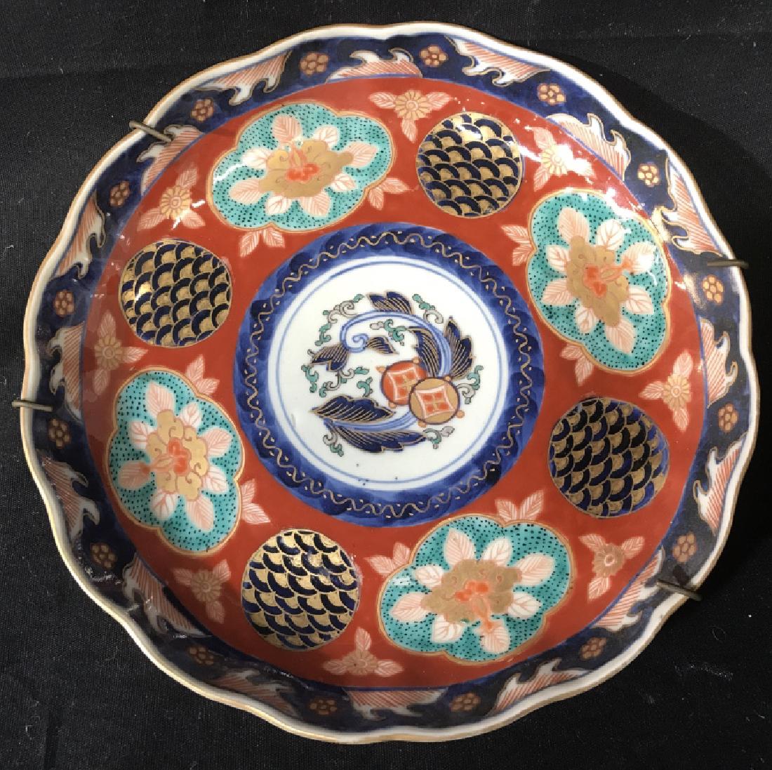 Antique Japanese Imari Porcelain Plate: Antique Japanese Imari Nishikite porcelain plate. Plate has certificate of date, issued by Uchida Art Co. Ltd. in Kyoto, Japan, in 1978. Plate is approx 140 years old, a product of the Tempo period (1