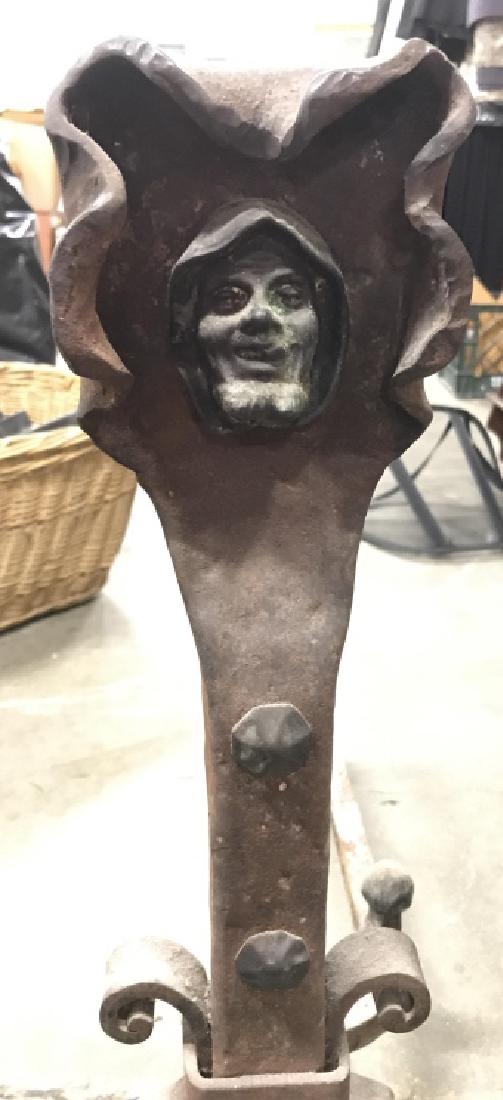 Pair Copper Toned Andirons: Andirons are Copper Toned. Contains beveled facial detail on top of pieces. Each measures approx 25 inches tall 22 inches deep 13 inches wide. Portrait sculpture, home accessory, fire pit decor, 6