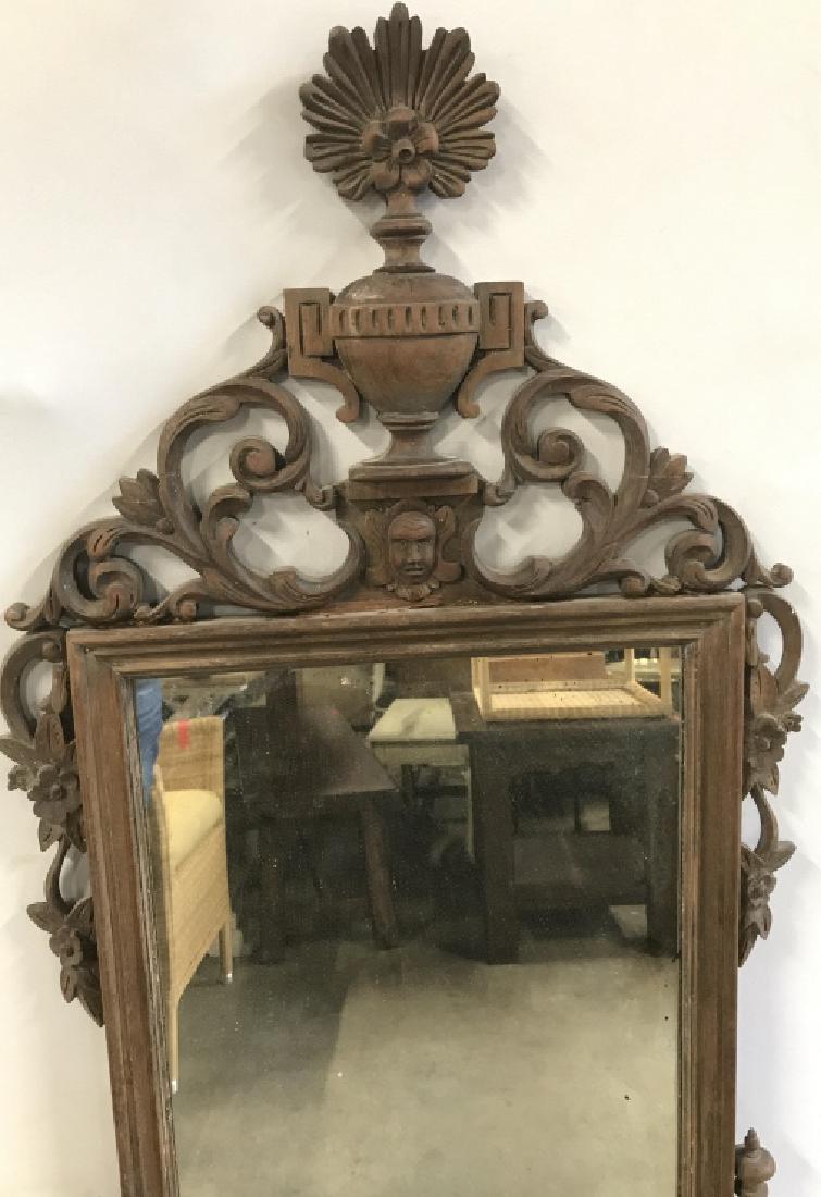 Antique Carved Wooden Wall Mirror: Antique Carved Wooden Wall Mirror With floral and Scroll open work design and center Figural Head, needs cleaning, has some cracks, measures approximately 57 inches tall x 35 inches wide. Vintage Hall