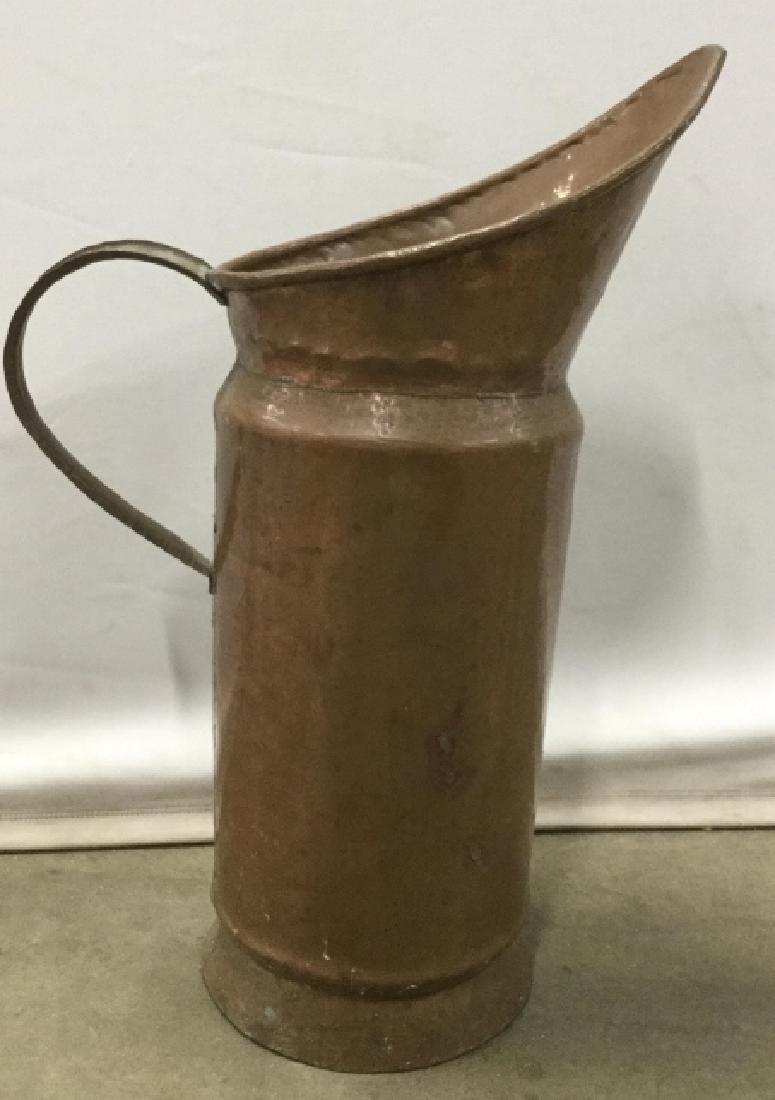 Vintage Tall Copper Metal Floor Pitcher: Tall Copper metal floor pitcher, umbrella holder. Measures approx 20.5 inches in height by 14.5 inches in width with handle, 8 inches in diameter at opening. There are two large dents to one side of P