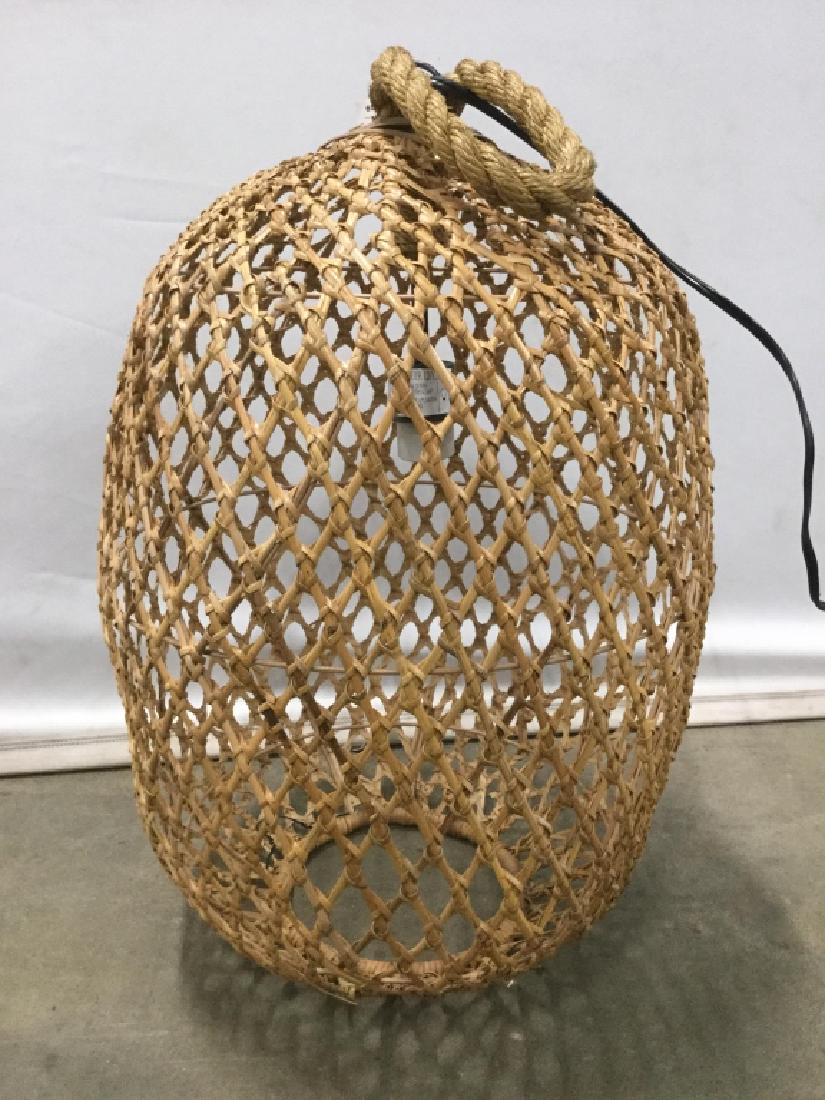 Retro Pottery Barn Woven Pendant Lamp: Retro style Pottery Barn Woven pendant hanging lamp. Lamp could be used as a floor / table lamp. Shade is possibly woven rattan. Lamp has not been tested. Lot includes original Pottery Barn shipping b