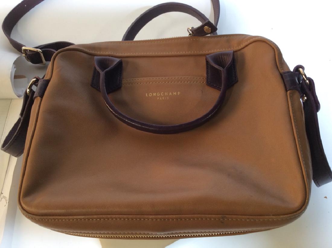 Longchamp Paris Satchel W/ Cross Shoulder Strap: Leather Carmel w/ Maroon straps, Inside Zipper Pocket - Lrg, 2 Inside Open Pockets, Key Clip, Shoulder Cross strap expands to approx 24 in measured from center, Strap not detachable, Good Condition w/