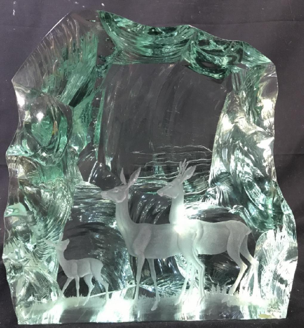 VICKE LINDSTRAND KOSTA Etched Crystal Of Deer: Tag on piece reads KOSTA SWEDEN. Piece depicts 3 deer figures. Piece is Etching I’m Relief. Measures approx 9.5 inches tall 9 inches wide, 4.5 inches deep. unique tabletop decor, shelf piece, home a