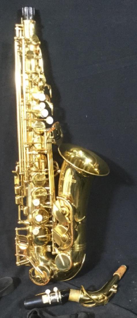 Alpine A00- 240 Alto Saxophone: Complete With Box, Strap, Body, Mouth Piece, Ligature, Neck Cork, Possibly Mother Of Pearl Key Buttons. Some Areas of Worn Brass On Body. Maintains Brass Shine. Body is approx. 23 in. long. Carry Box 