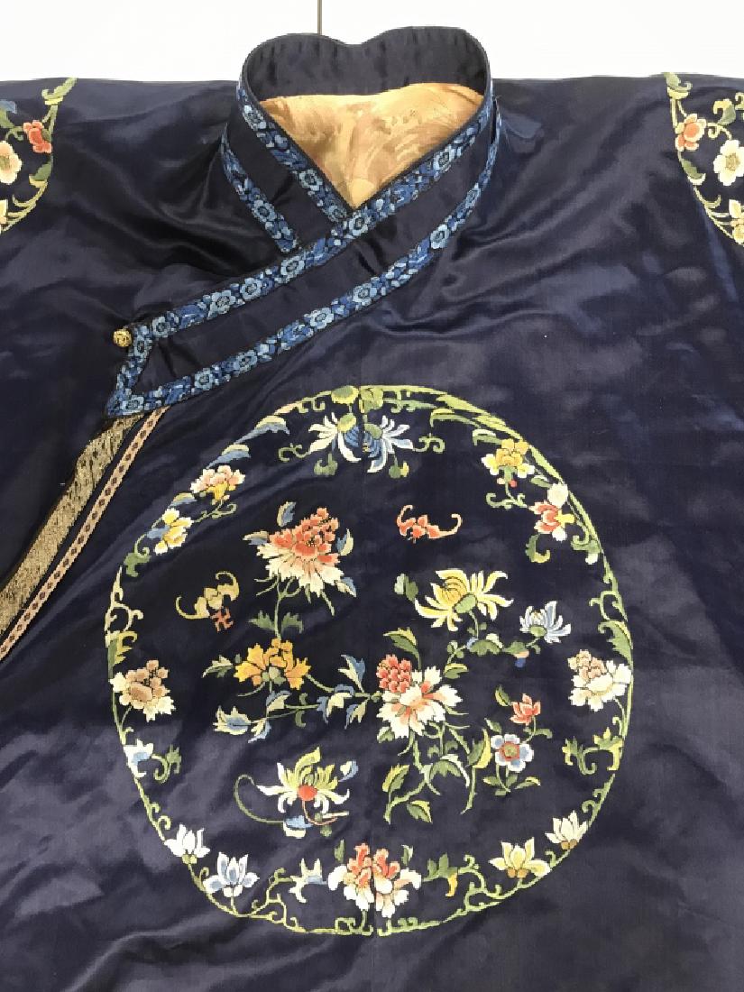 Vintage Chinese Embroidered Silk Robe: Vintage Chinese Embroidered Silk Robe with navy blue background and multicolored floral, leaf, and mountain motif, gold toned thread design on lower hemline, interior is lined with pink toned silk fab