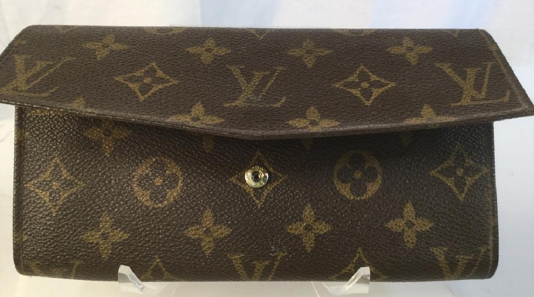 AUTHENTIC LOUIS VUITTON MONOGRAMMED WALLET: Vintage Brown, Long, Monogrammed Women’s Wallet. Some discoloring on interior, may need cleaning, No Scuffs on Outside. Middle Zipper Compartment for Change And Two Long Compartments. Snap Closing,