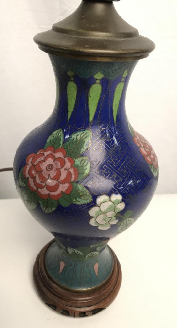 Asian Cloisonné Lamp W Floral & Leaf Detail: Lamp is cloisonné. Contains tones of blue, gold, white, teal, pink, and magenta. Contains wooden base. Measures approx 14 inches tall 4.5 inches wide. Table lamp, home decor, home accent, oriental de