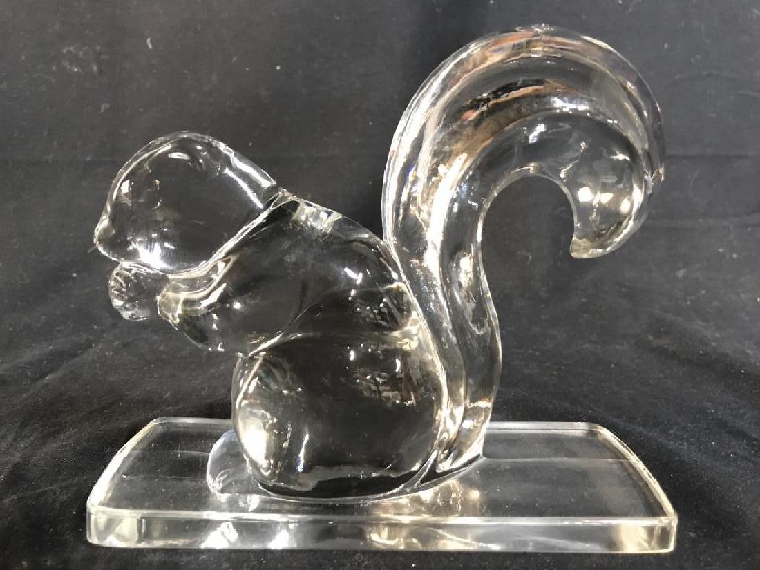 Pair Art Glass Crystal Squirrels: Lot includes 2 art glass squirrel figurals. Depicts squirrels eating nuts. Each Measures approx 6.5 inches long, 5.5 inches tall, 2.5 inches wide. Bookends, shelf decor, mantelpiece decor, home accent