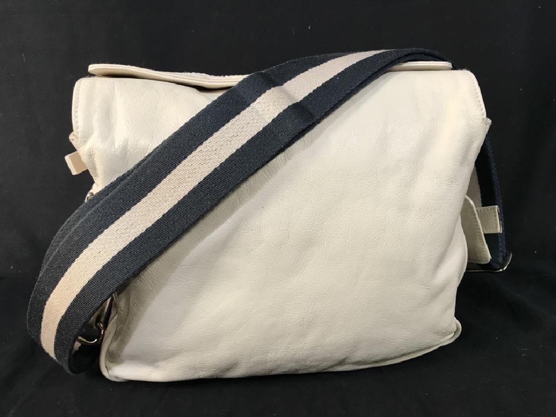 BALLY Cream Toned Leather Shoulder Bag: BALLY Cream Toned Leather Shoulder Bag With magnetic top closure, interior in black, red, and beige toned fabric lining with Bally embroidered in stripe, two additional Bally embossed in leather, adju
