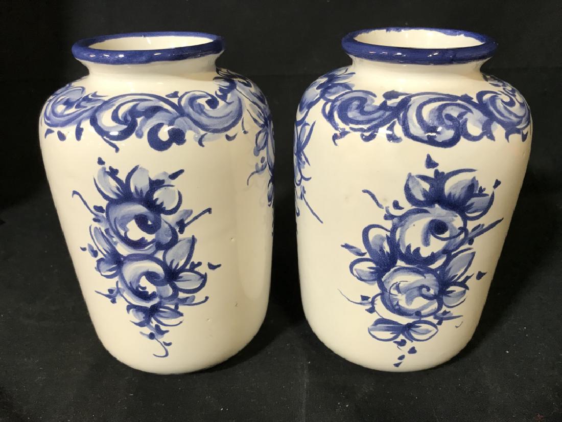 Pair VESTAL Hand Painted Floral Detailed Vase: Lot includes 2 porcelain vases with floral and leaf detail. Underside reads VESTAL MADE IN PORTUGAL HAND PAINTED. Porcelain vases, floral vases, hand painted vases. Each measures approx 6.5 inches tal
