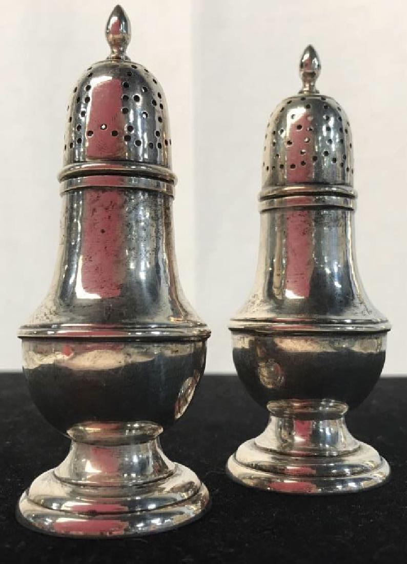 Pair ONC Sterling Silver Salt & Pepper Shakers: Possibly antique. Marked on underside ONC, Sterling, 2254. ONC possibly for Old Newbury Crafters. Each measures approx 4.5 inches in height by 1.6 inches in diameter at base. Pieces might need polishi