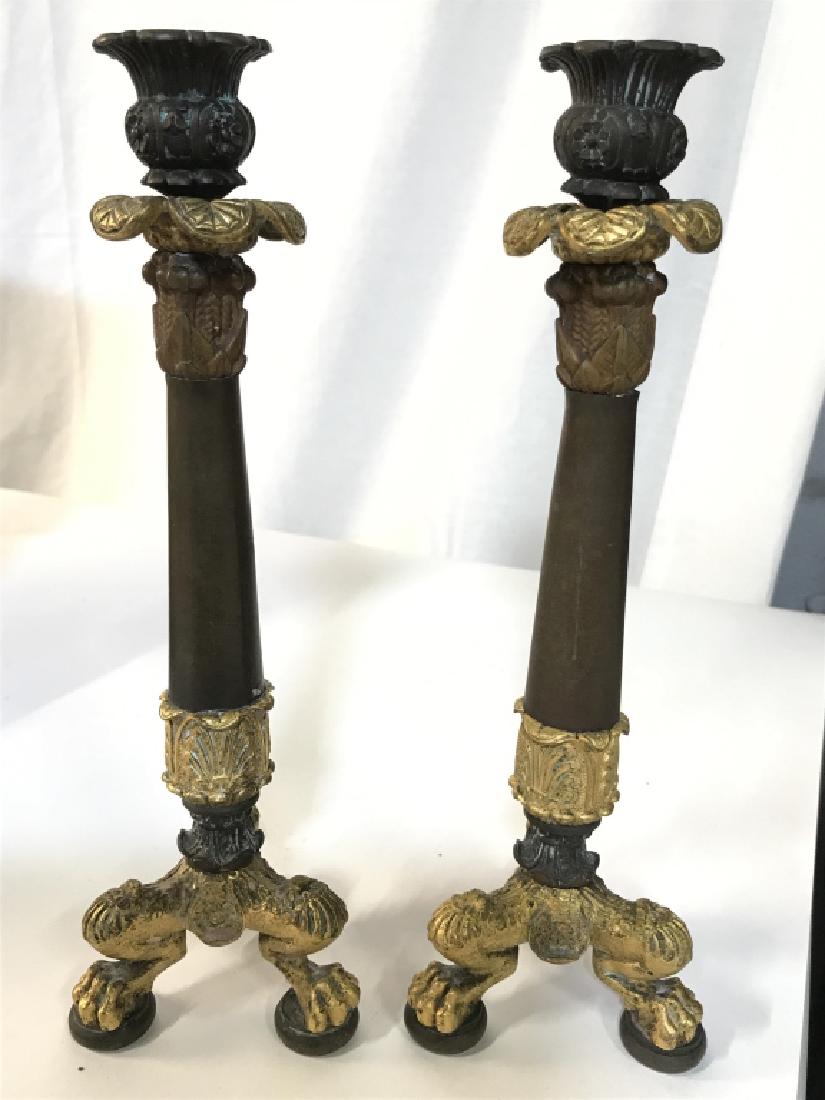 Pair Ormolu & Metal Claw Foot Candlesticks: Candlesticks are ormolu and metal, possibly bronze. Each has 3 gold toned feet and furled out floral detail near top. Each measures approx 10.5 inches tall 3.5 inches wide. decorative home accent, tab