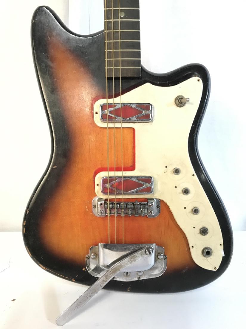 SILVERTONE Electric Guitar W Case: Piece is marked SILVERTONE. Contains tones of beige black cream and silver. Measures approx 37 inches tall 12 inches. Needs repair. musical instrument, collectible instrument 6.