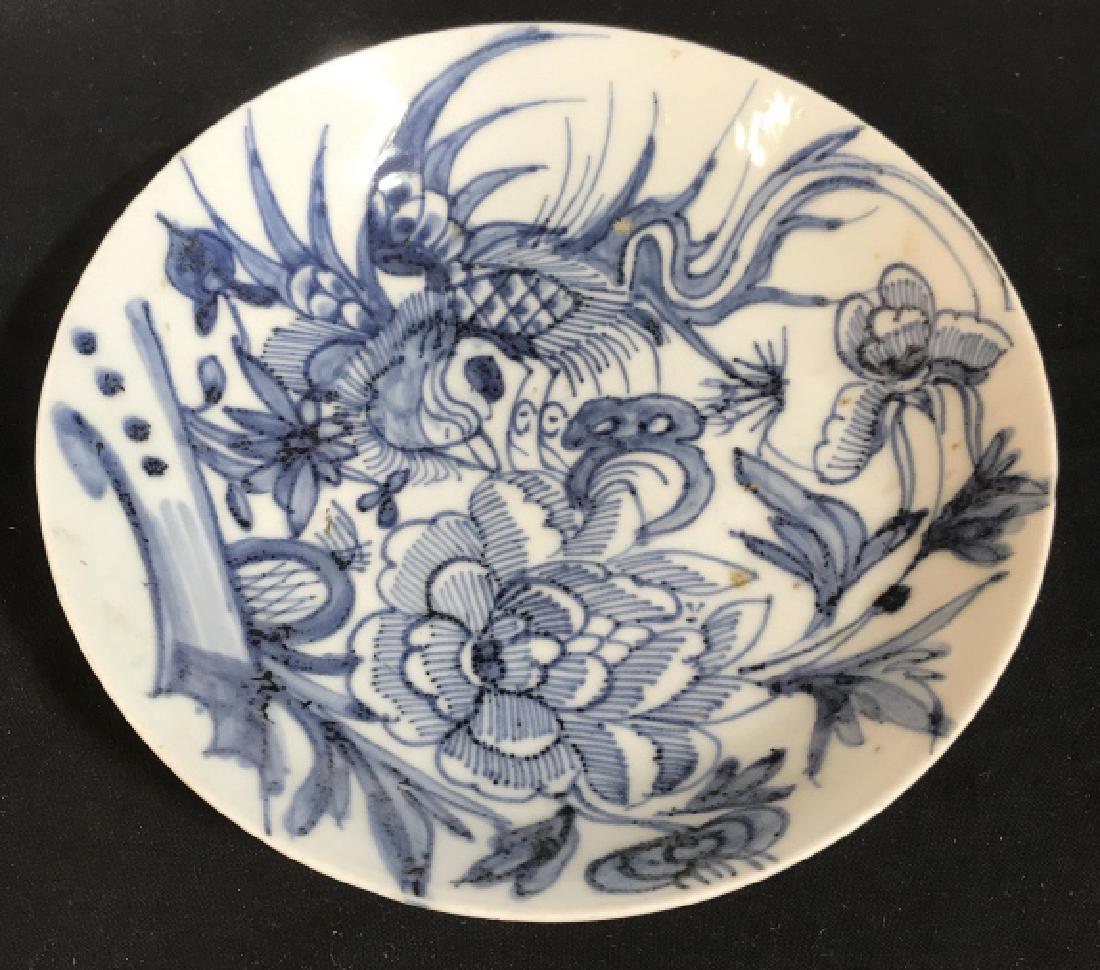 Signed Asian Ming Dynasty Style Ceramic Bowl: Signed Asian ceramic, porcelain, pottery bowl, blue & white pottery. Signed on underside. Ming dynasty style pottery with bird motif. Measures approx 9.5 inches in diameter by 2 inches in height. Bowl