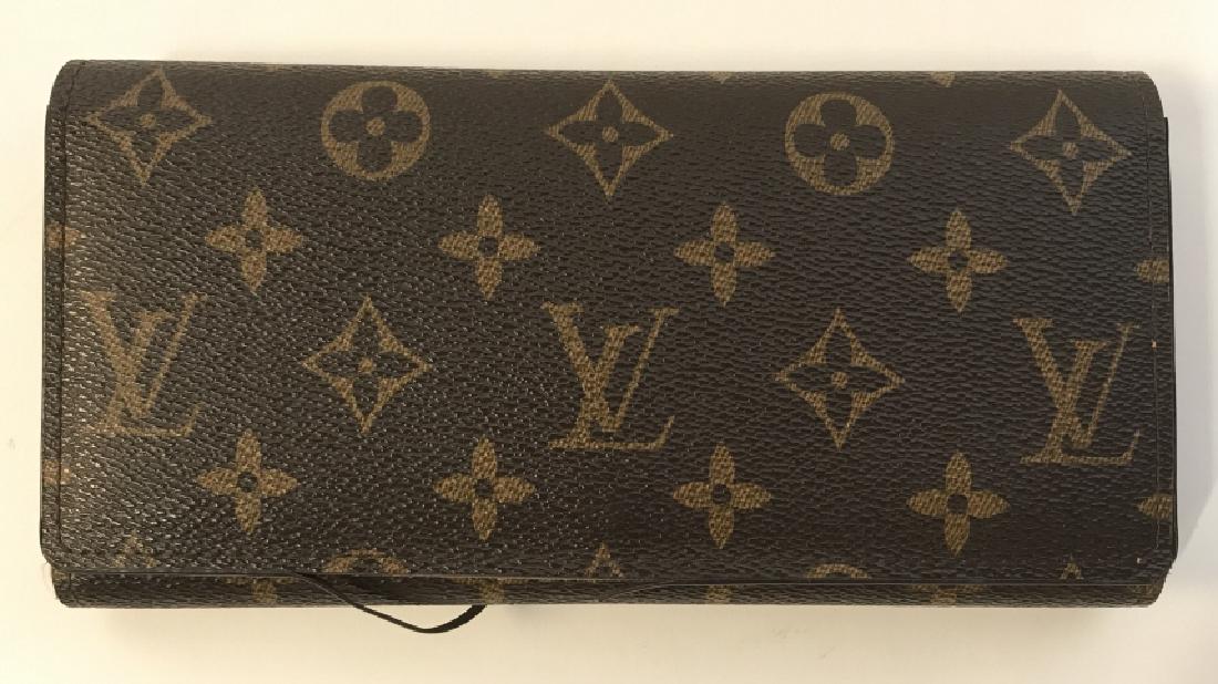 LOUIS VUITTON Monogram Wallet Poss Authentic: LOUIS VUITTON Monogram Wallet Poss Authentic in classic brown and tax monogrammed exterior and brown interior, marked on interior with Louis Vuitton Paris made in France, measures approx 8 inches long