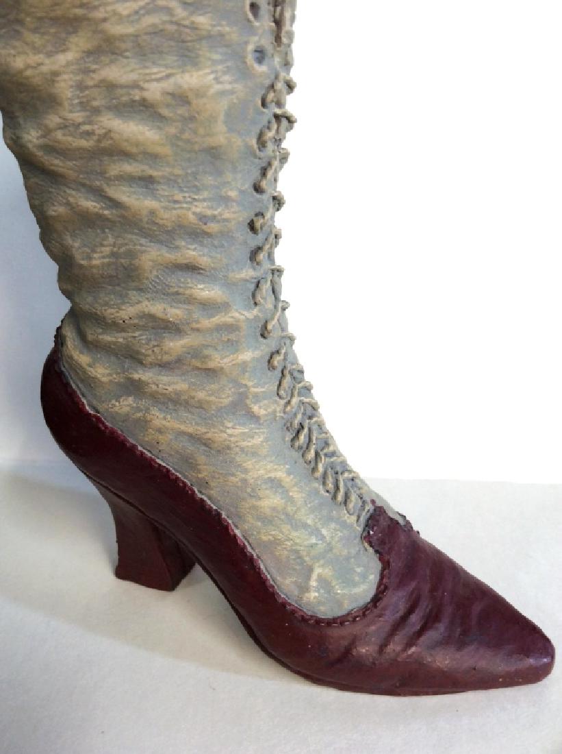 Victorian Boot Statuette Kp ‘97: Victorian Ladies Boot tabletop accessory, vanity accessory, some chips at top, cleaning required. Appears to be ceramic/porcelain. Measures approx 5 in by 4 in. 4