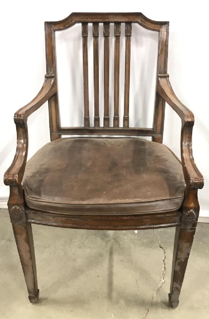 Carved Wooden MAITLAND SMITH End Chair: Underside is marked MAITLAND SMITH. Chair has intricately carved wooden detail. Includes brown toned leather cushion & caned seat underneath cushion. Measures approx 38 inches tall 23 inches wide & de