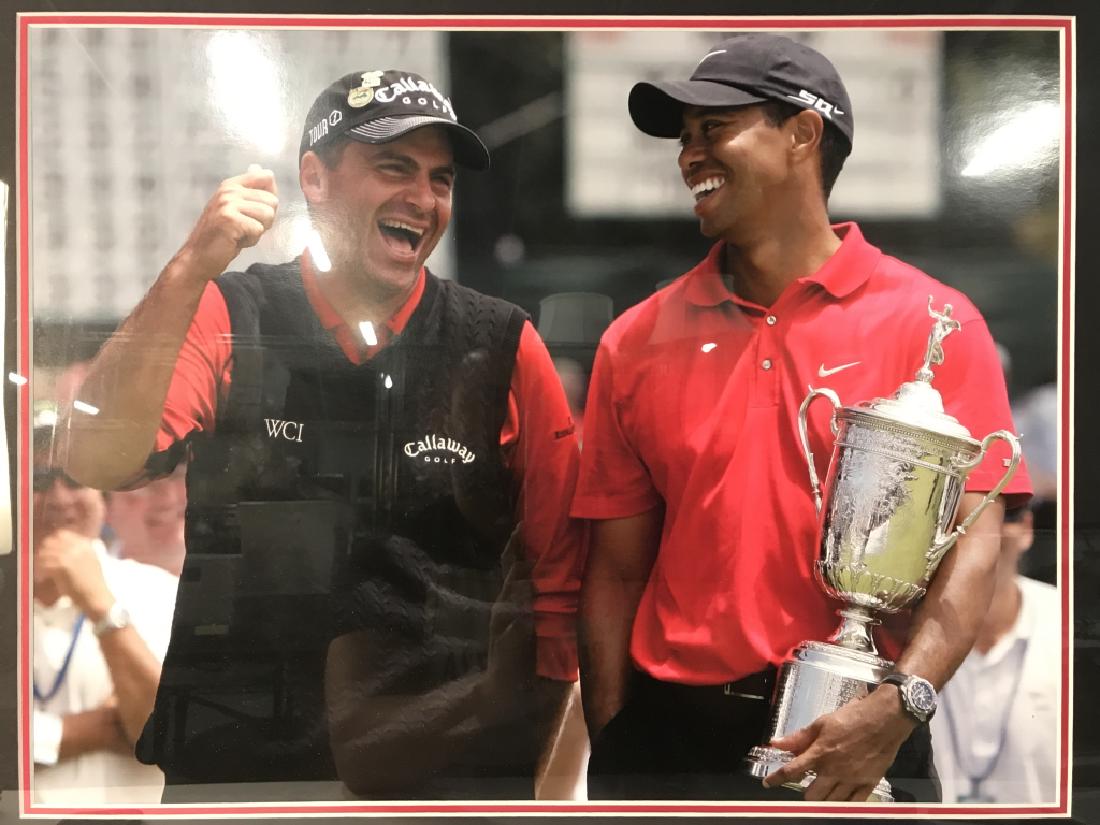 Framed Photo Print Of Tiger Woods & Rocco Mediate: Framed Photo Print Of Tiger Woods & Rocco Mediate. Piece is professionally framed and matted. Measures approx 28 inches long 24 inches tall. Golf Memorabilia, Sports memorabilia, golf collectible, 6.