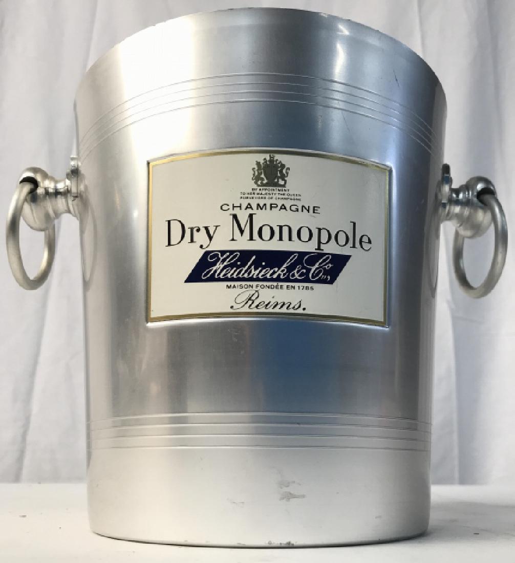 Heidsieck & Co Metal Ice Bucket W Handles: Front of piece reads HEIDSIECK & CO. Piece is silver toned and metal. Measures approx 10 inches wide 8 inches tall. Ice bucket, tableware, barware, tabletop accessories 6