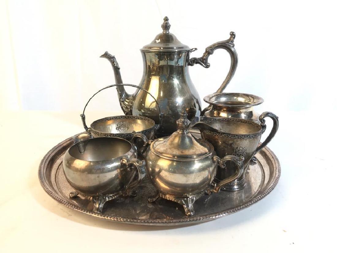Group Lot Silver Pl Coffee Service Tray More: Group Lot of Silver Plate including circular etched tray diameter app 15 inches, Footed coffee pot ht app 9.5 inches, sugar creamer marked for Triumph William Rogers, embossed Etched And Repousse Silv