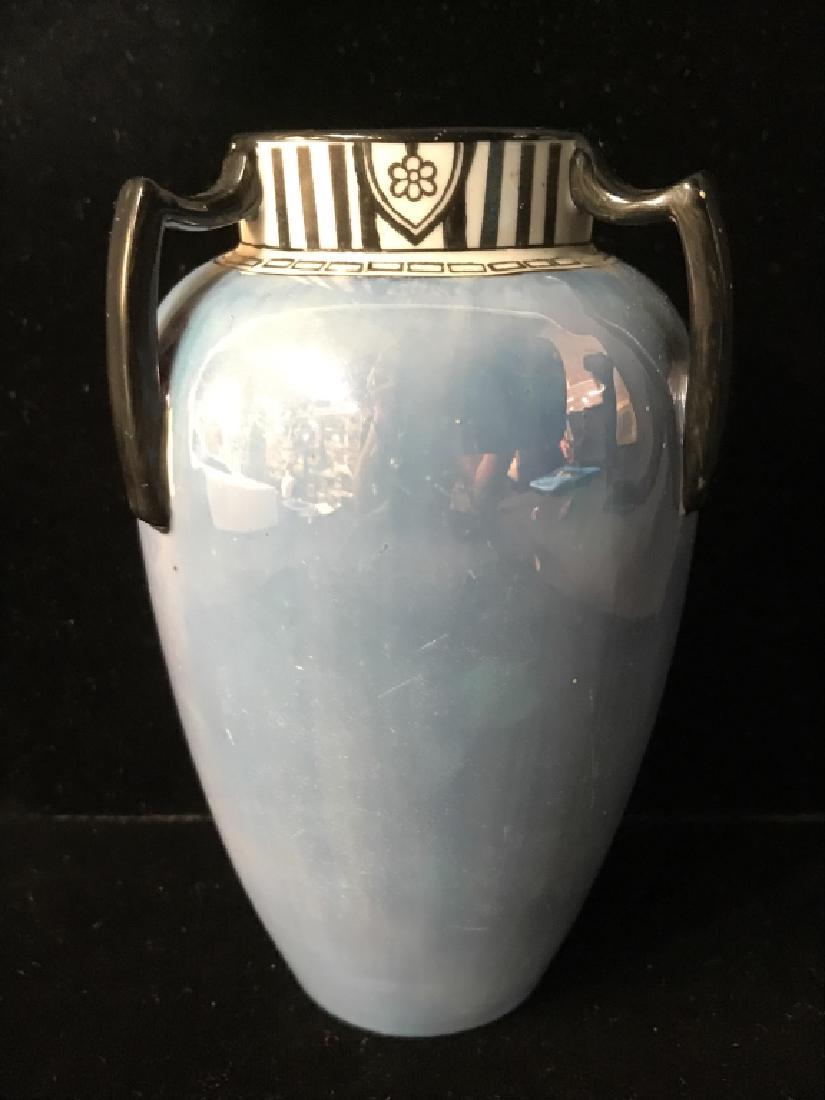 NORITAKE Hand Painted Porcelain Vase: Underside of piece reads NORITAKE HANDPAINTED. Piece has light blue tone with black toned handles and stripe detail near top. Measures approx 6 inches tall 3.5 inches wide. Vase vessel, tableware, tab